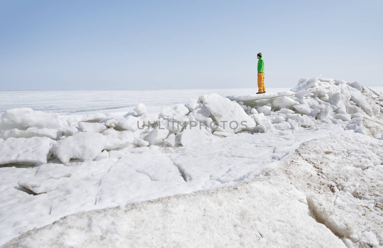 Young adult man outdoors exploring icy landscape by Novic