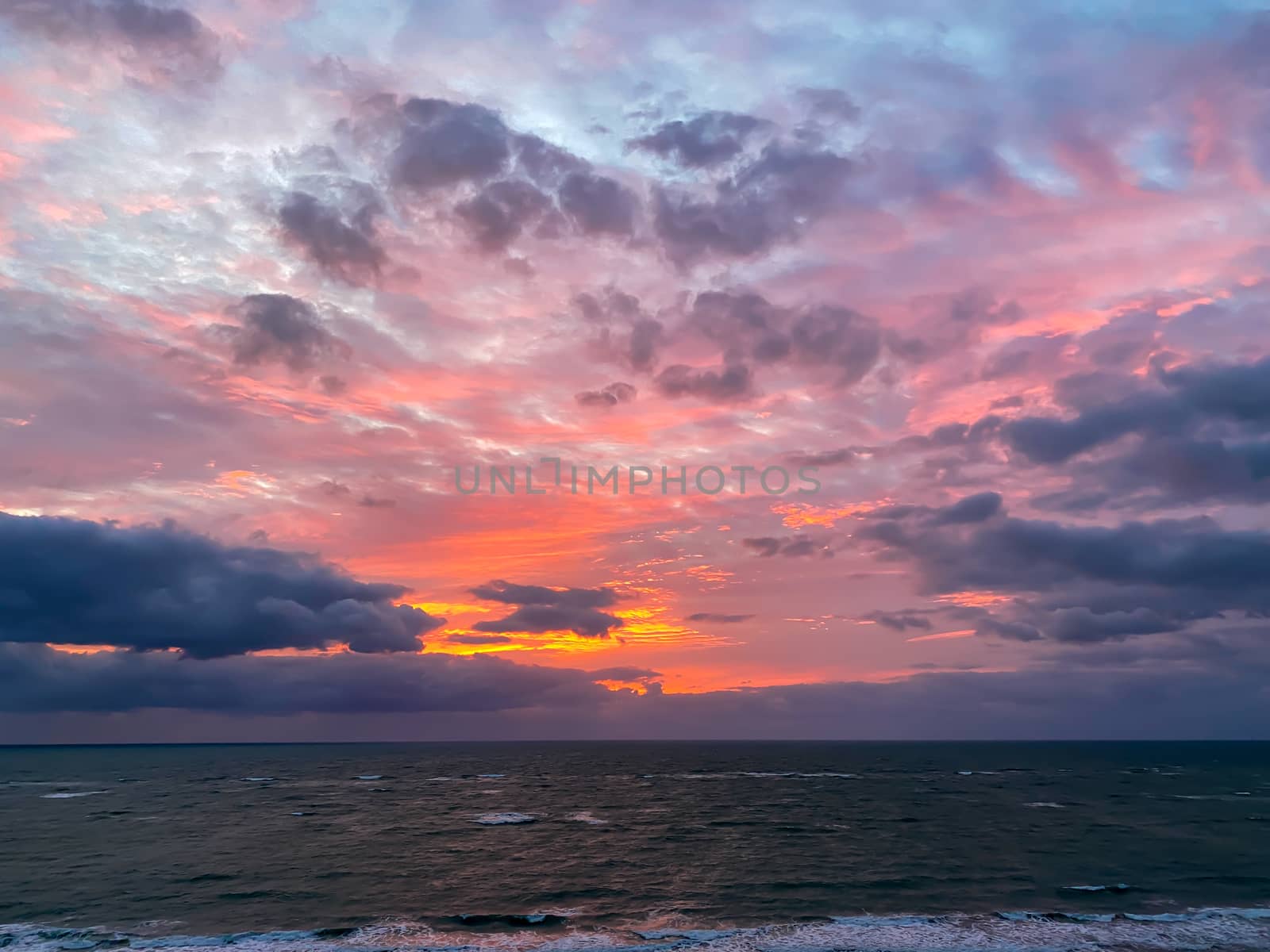A vibrant sunrise over the Atlantic Ocean on North Hutchinson Island in Florida.