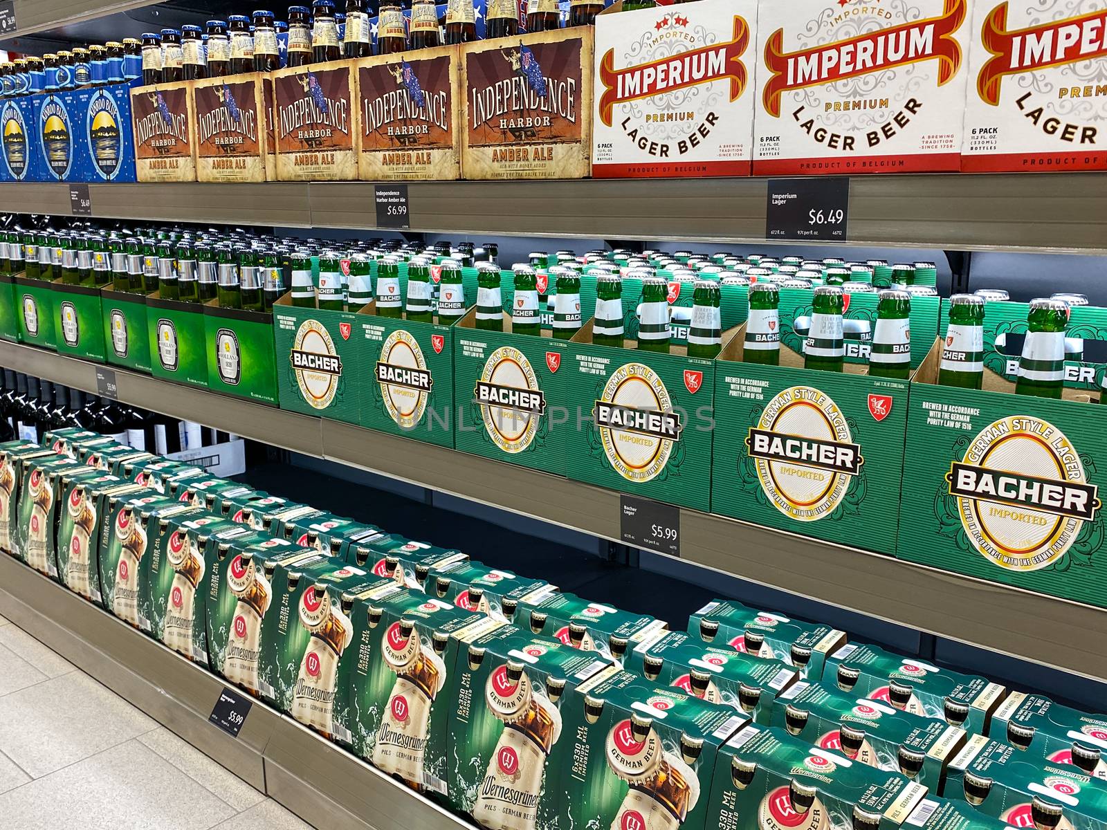 A display of 6 packs craft beer at an Aldi grocery store waiting by Jshanebutt
