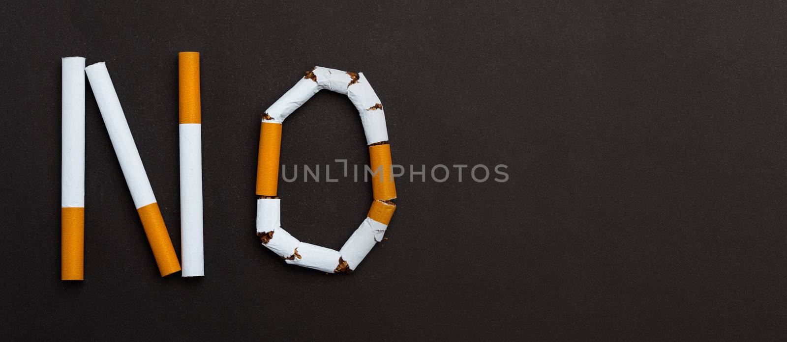 word STOP spelled text of the pile cigarette or tobacco by Sorapop