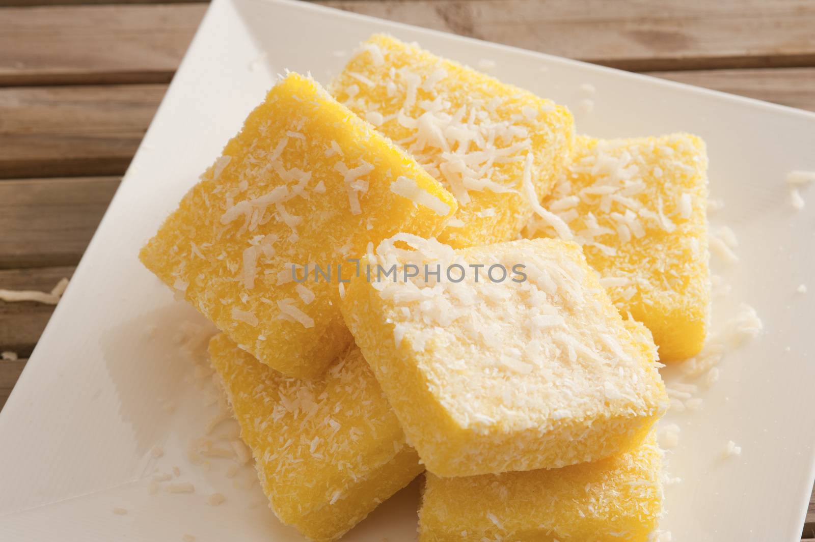 Plate with tasty lemon lamingtons in close up view