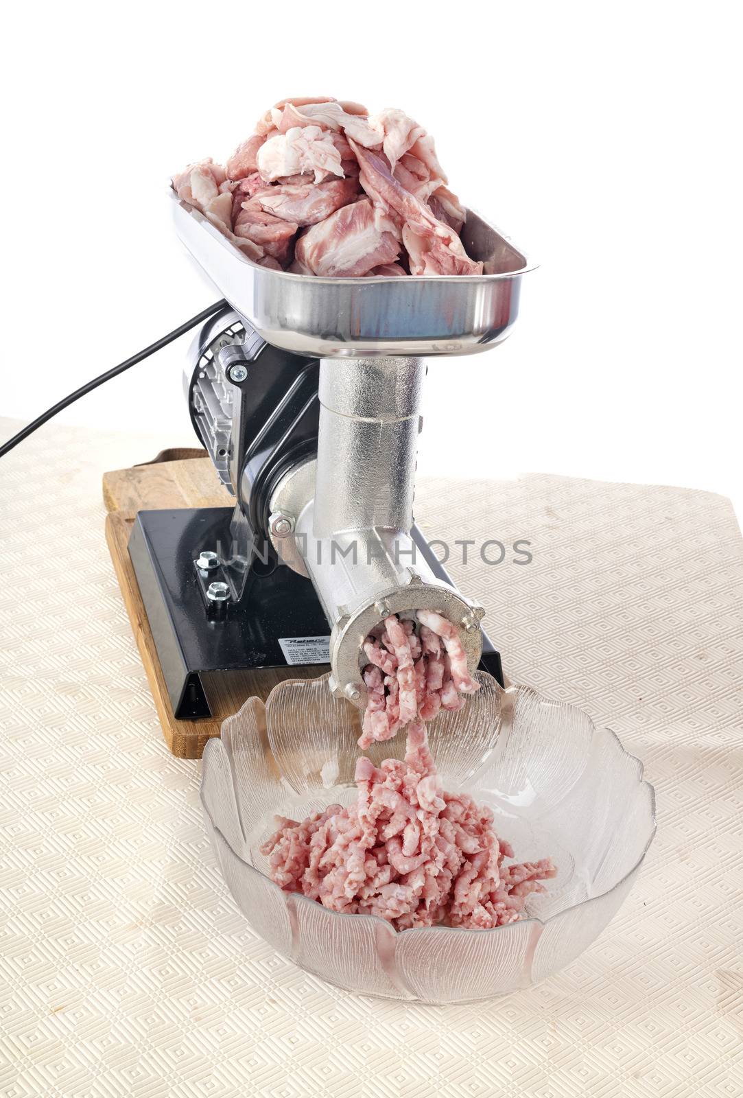 meat mincer in front of white background