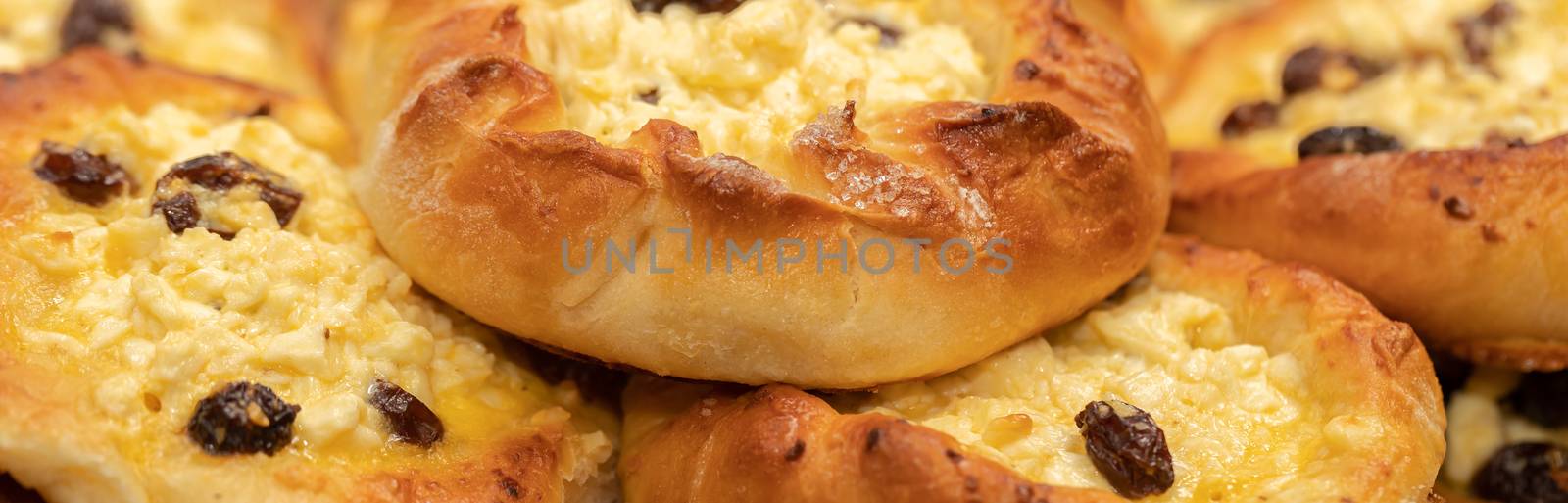 Fresh homemade open patties with cottage cheese traditional Russian pastry vatrushka, round buns, curd tart on linen napkin, white background, selective focus, closeup