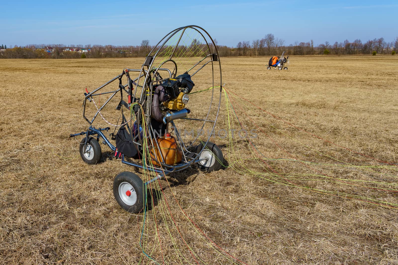 paraglider stands on the field prepared for flight by VADIM