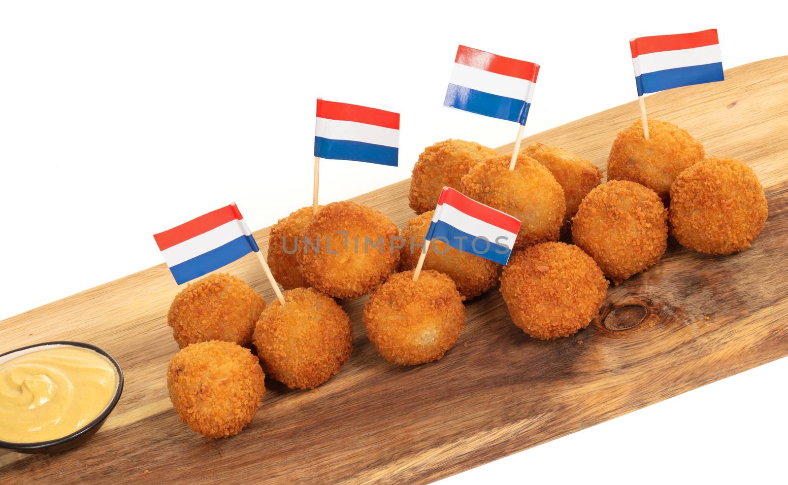 Dutch traditional snack bitterbal on a serving board, dutch flag, isolated