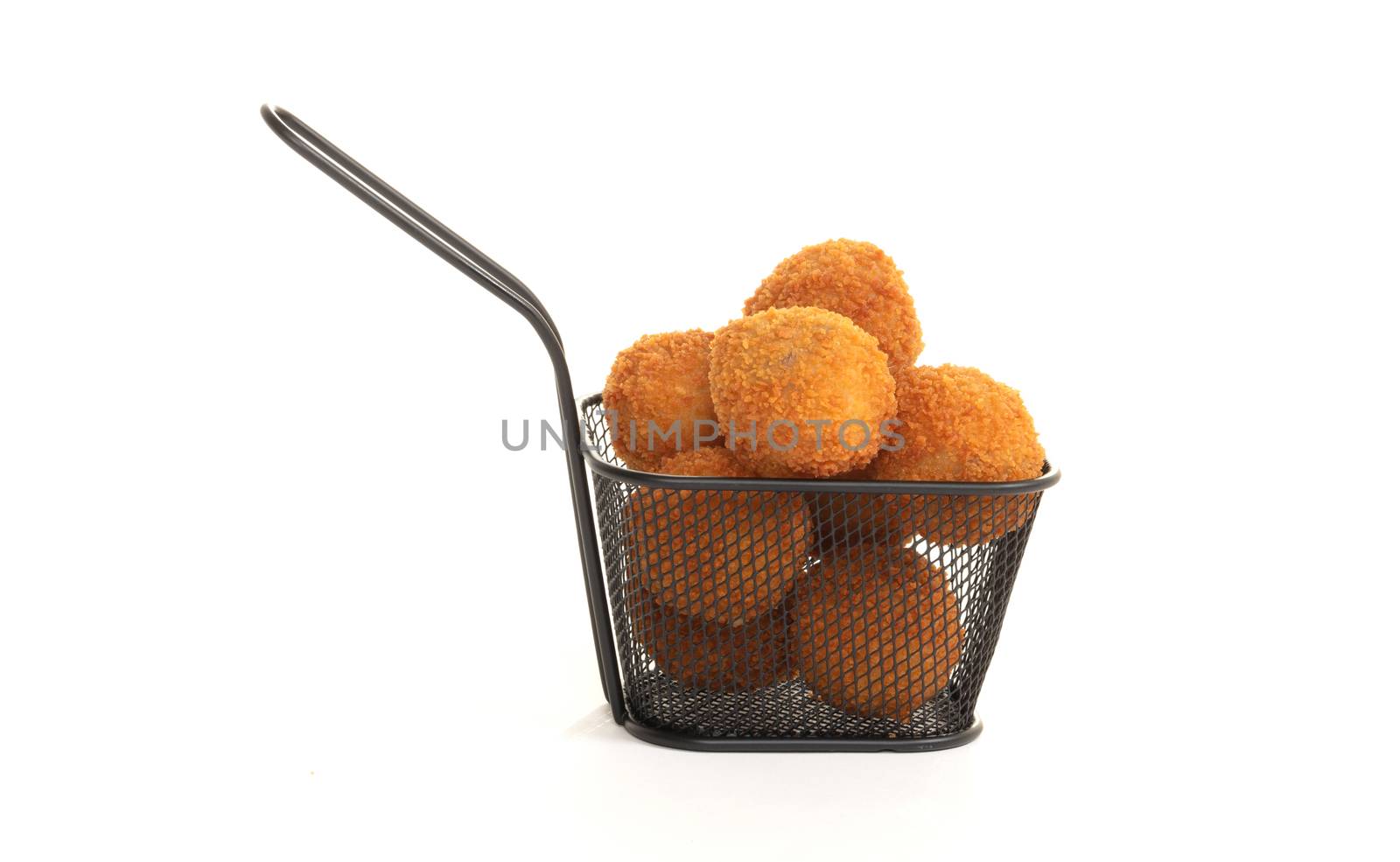 Dutch traditional snack bitterbal in a small basket, isolated