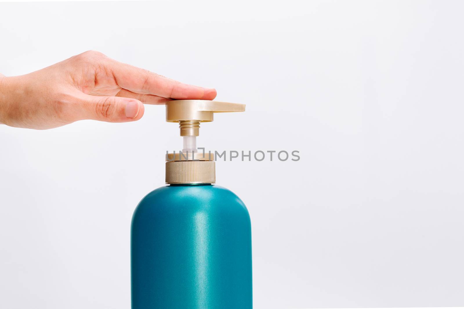 women hand apply hair shampoo conditioner bottle on white background. Beauty And Body Care Concept