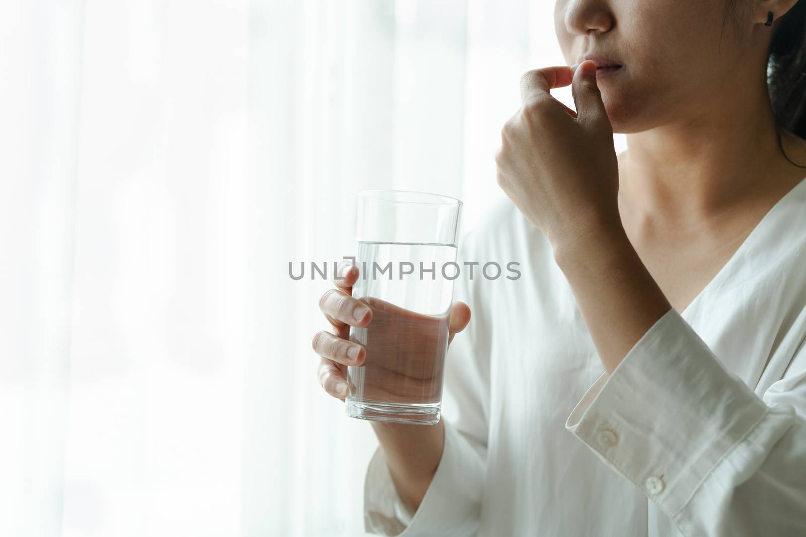 headache women take medicine with a glass of water, healthcare and medicine recovery concept