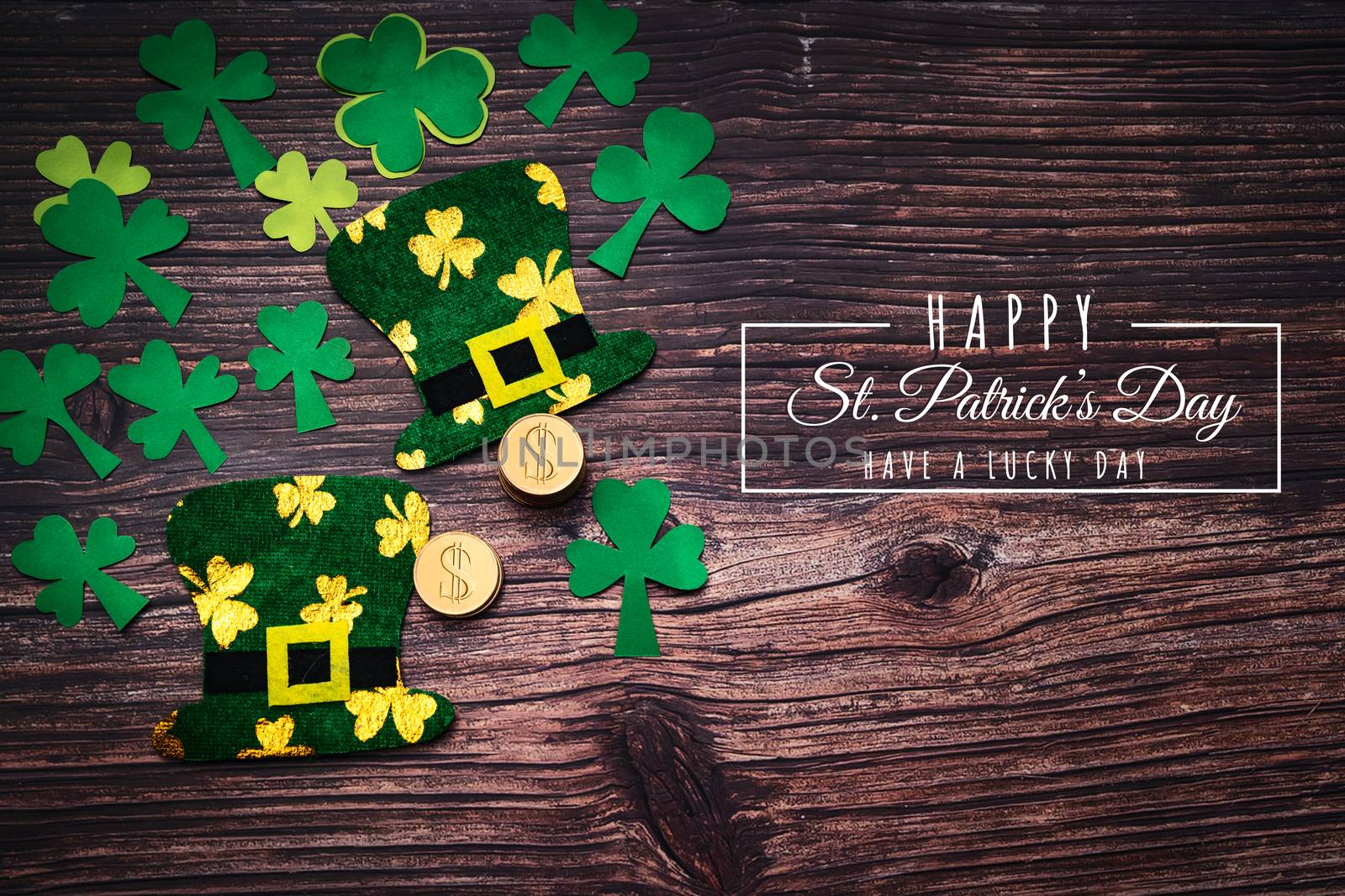 St Patricks Day, golden coins, festive hat and green Shamrocks with saint patricks day lettering on wooden