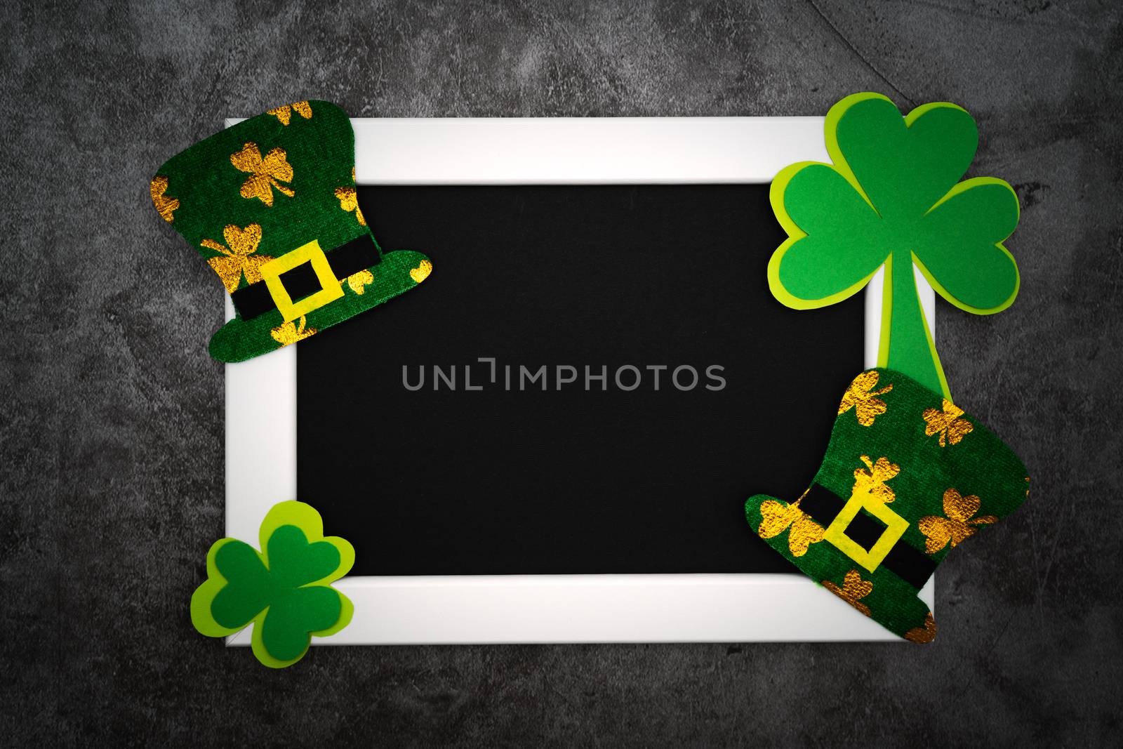 St Patricks day, festive leprechaun hat and green Shamrocks on photo frame