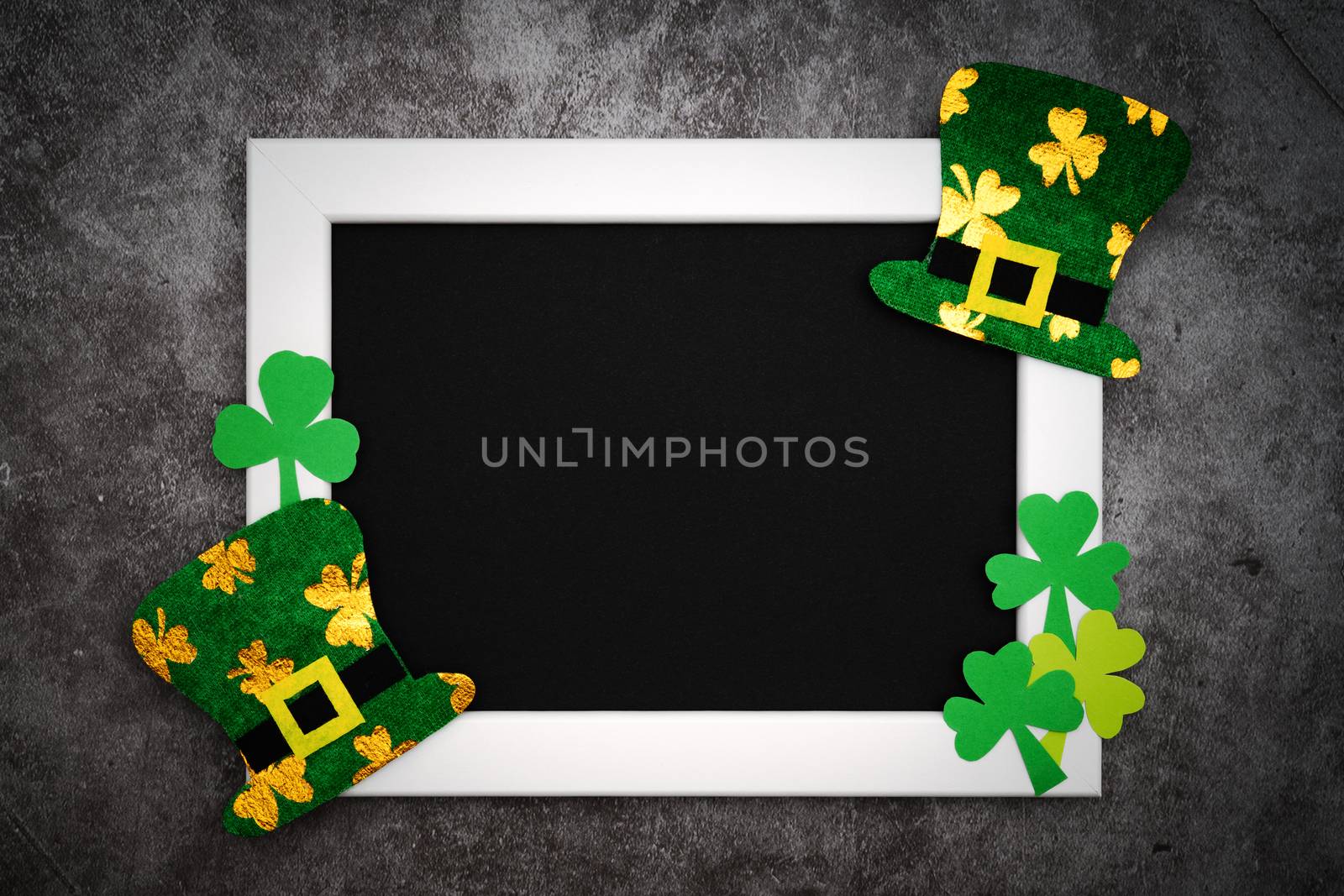 St Patricks day, festive leprechaun hat and green Shamrocks on photo frame