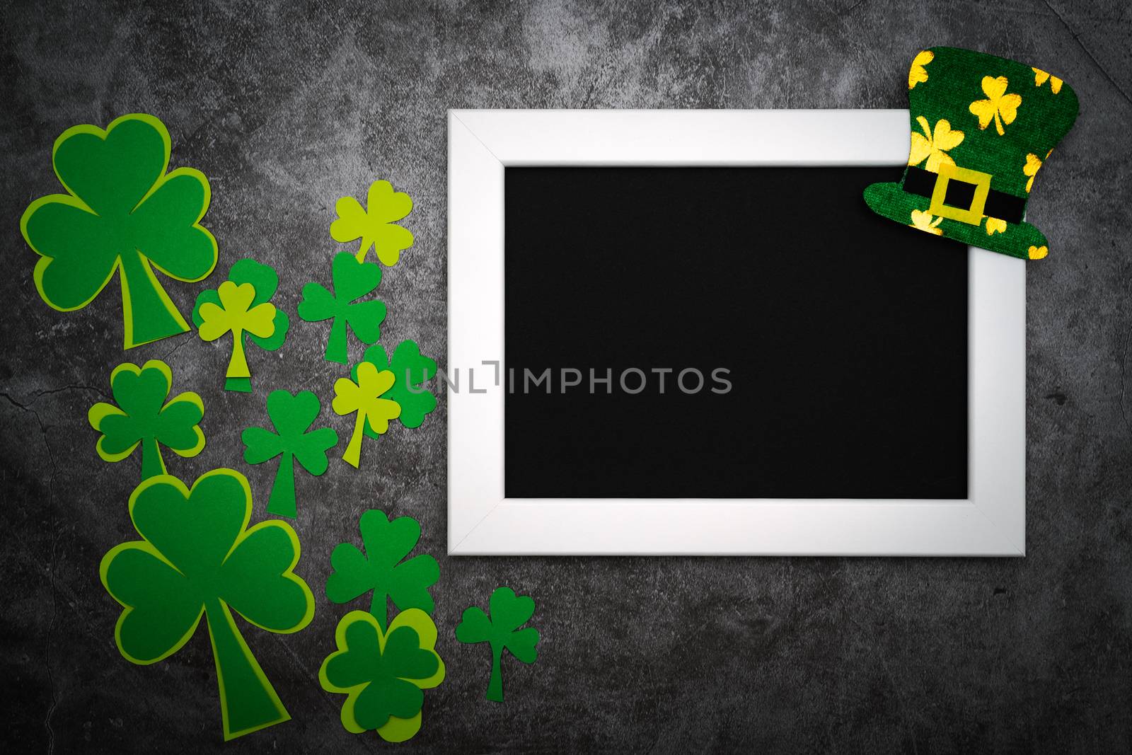 St Patricks day, festive leprechaun hat and green Shamrocks on photo frame