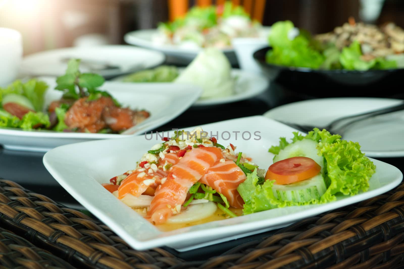 Spicy Salmon Salad with fresh chilli and garlic, Thai food style. Home made food. Concept for a tasty and healthy meal