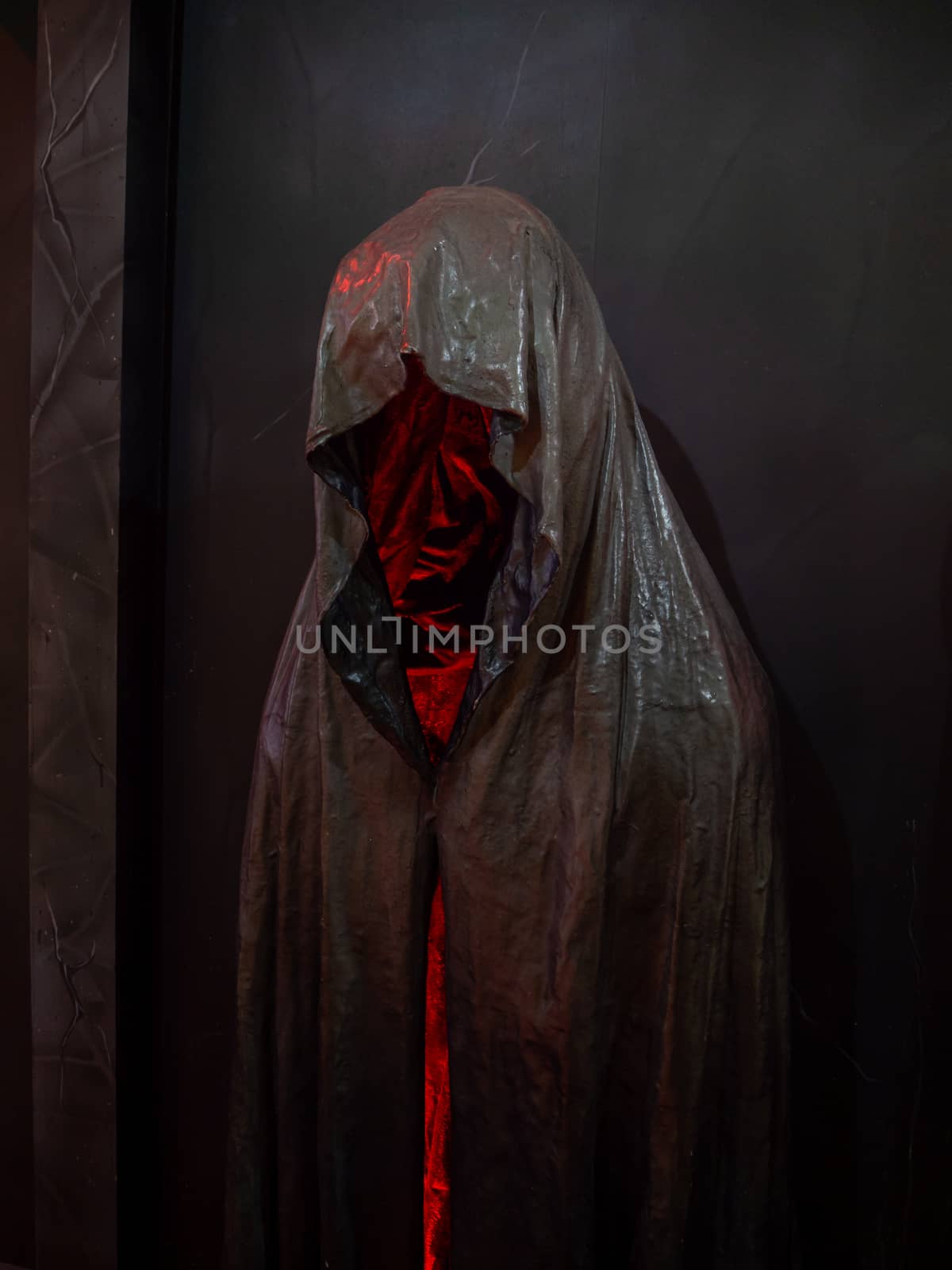  Ghost Tours, Skeleton holding in hood  against structure at nig by shutterbird