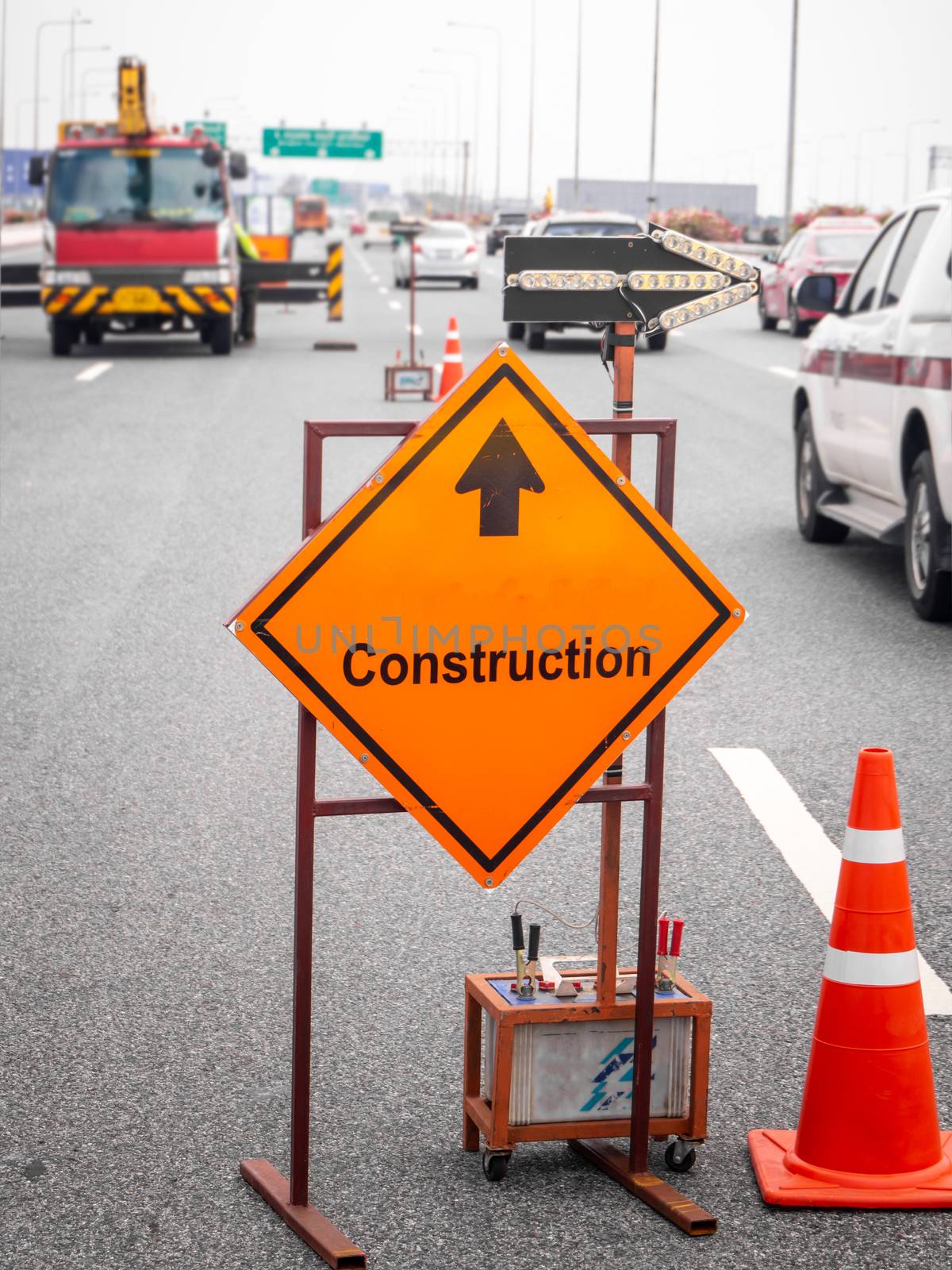 The signs repairs road and worker on the road