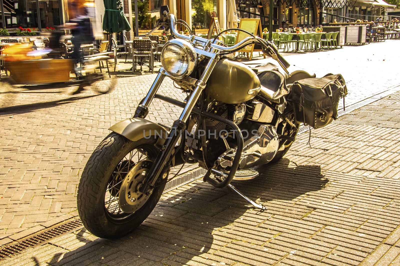 old and powerful vintage motorcycle with backpacks on a street in the old city of Breda. Netherlands Netherlands