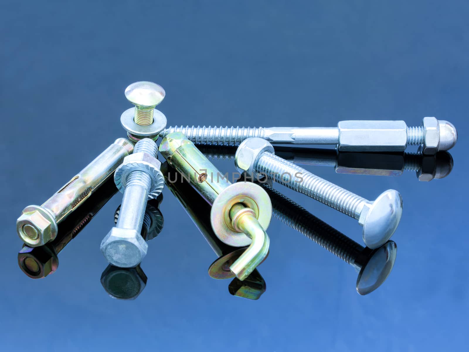 Screwbolts screw nuts, hanger and bolt washers on blue background construction concept. by Sergii
