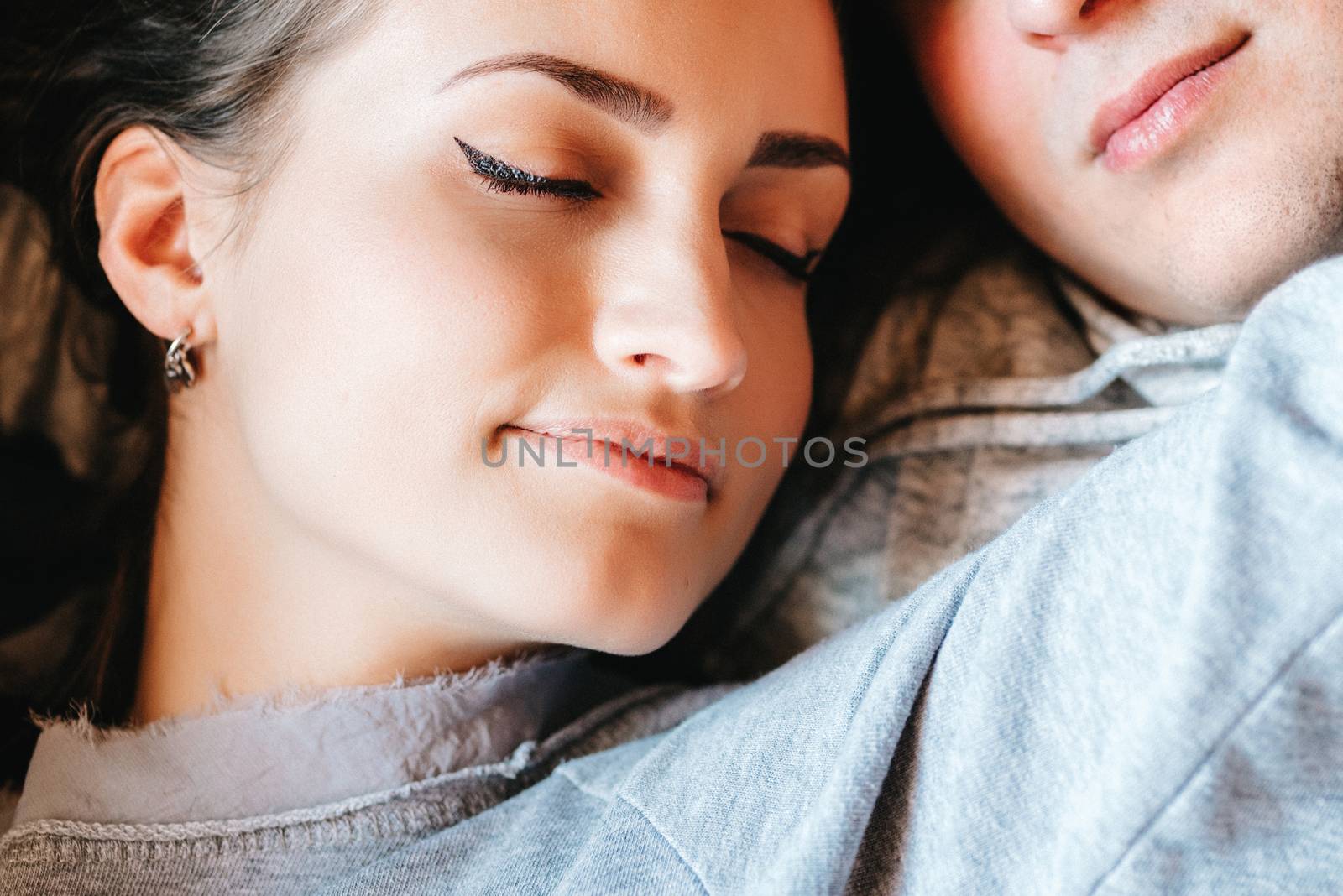 guy and girl in the house near the window overlooking a snowy landscape