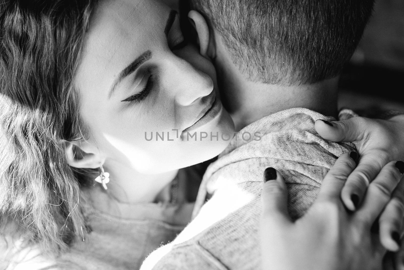 guy and girl in the house near the window overlooking a snowy landscape