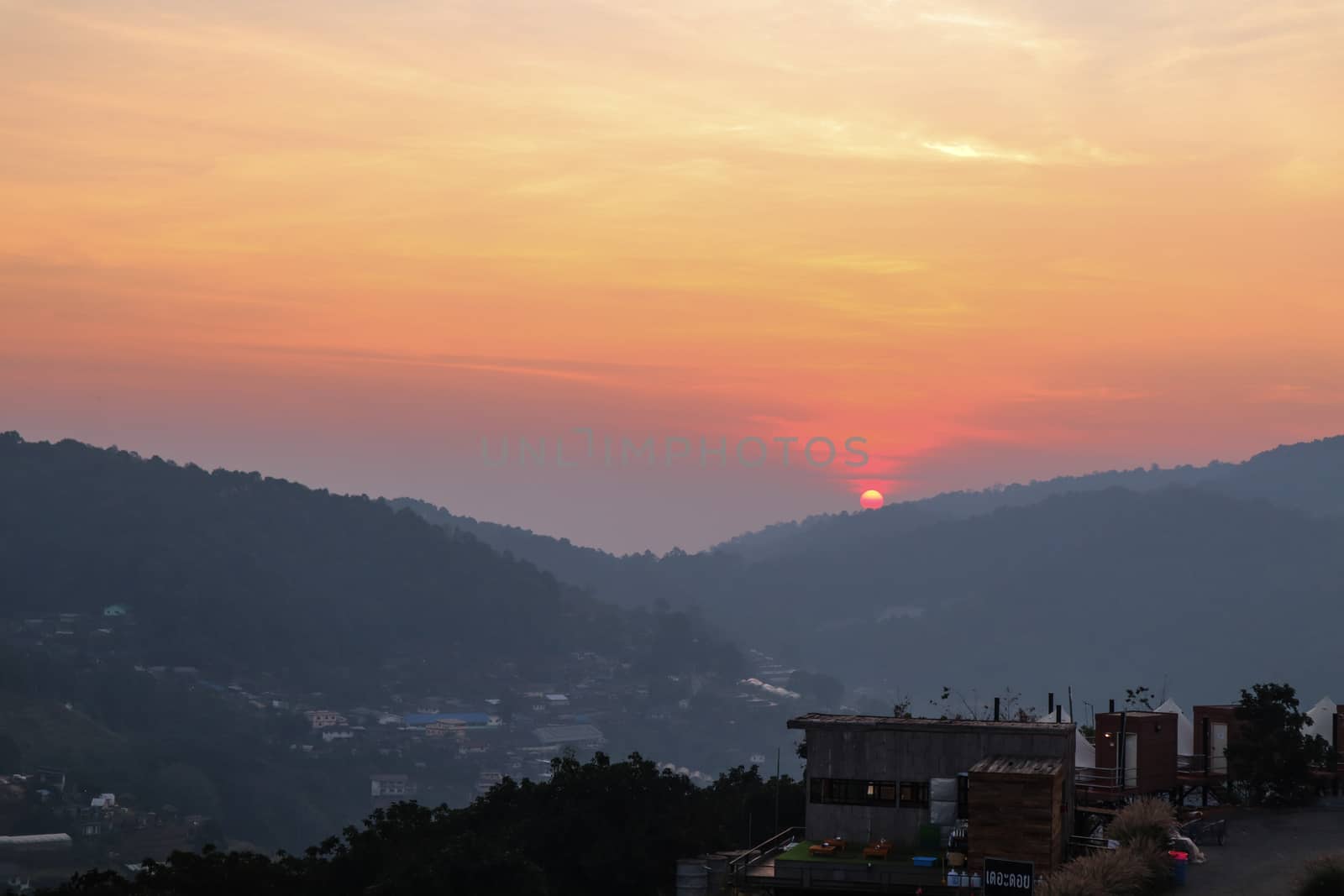 Colorful sunset over the mountain hills in a thai village near mountains in Chiang Mai, Thailand. The mountain scenery view