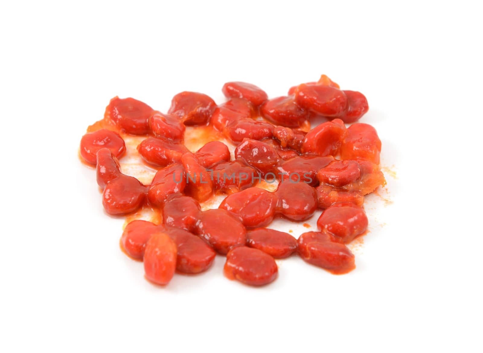 Bitter melon seeds covered in sticky red pith - momordica charantia - isolated on a white background