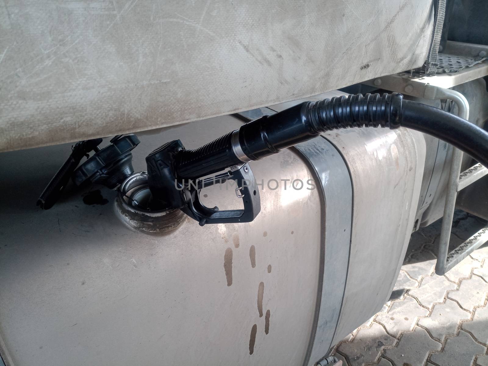 Diesel refueling gun in a truck tank.