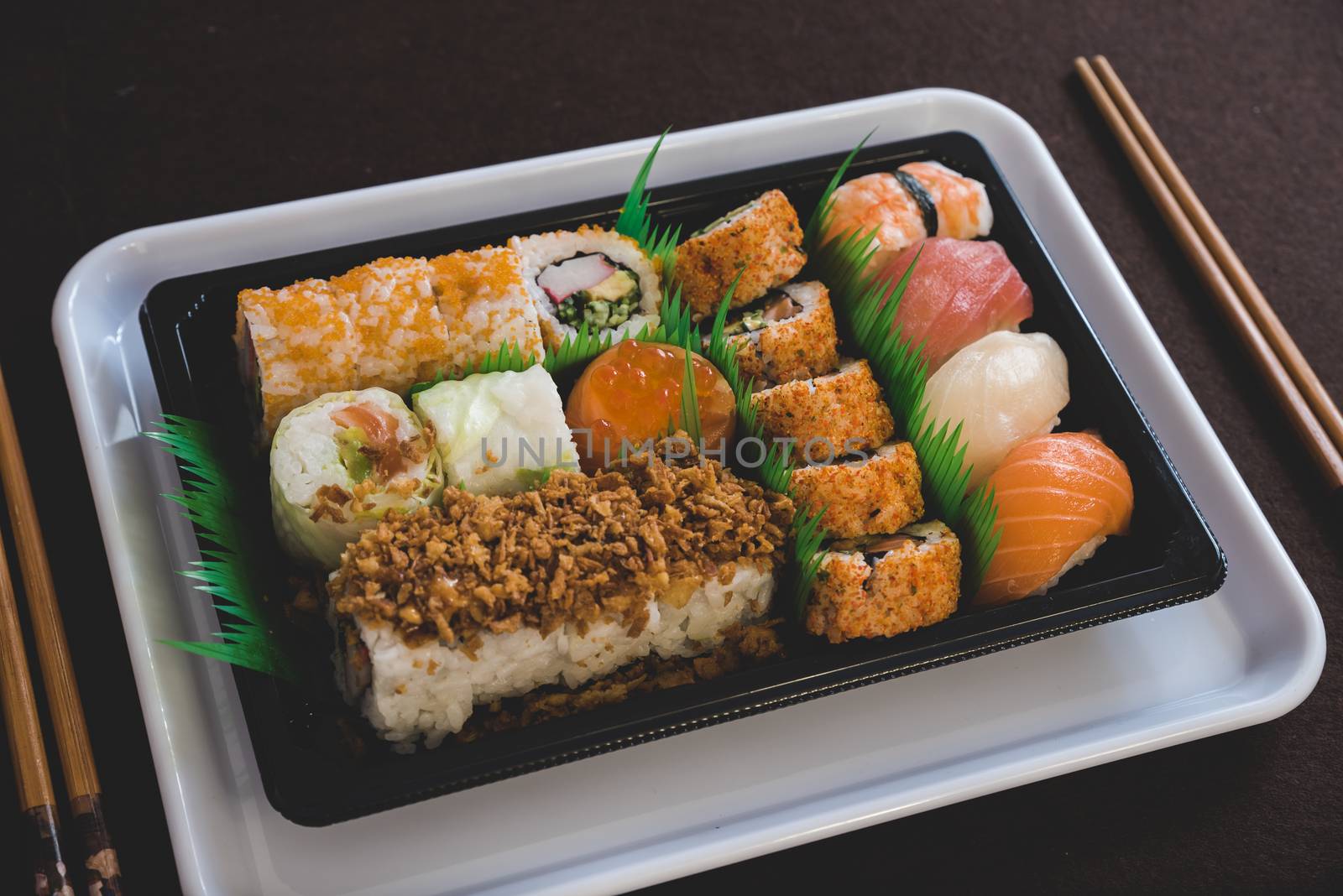 Raw fresh Salmon sushi roll maki - japanese food.