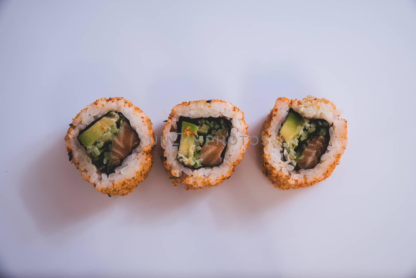 Raw fresh Salmon sushi roll maki - japanese food.