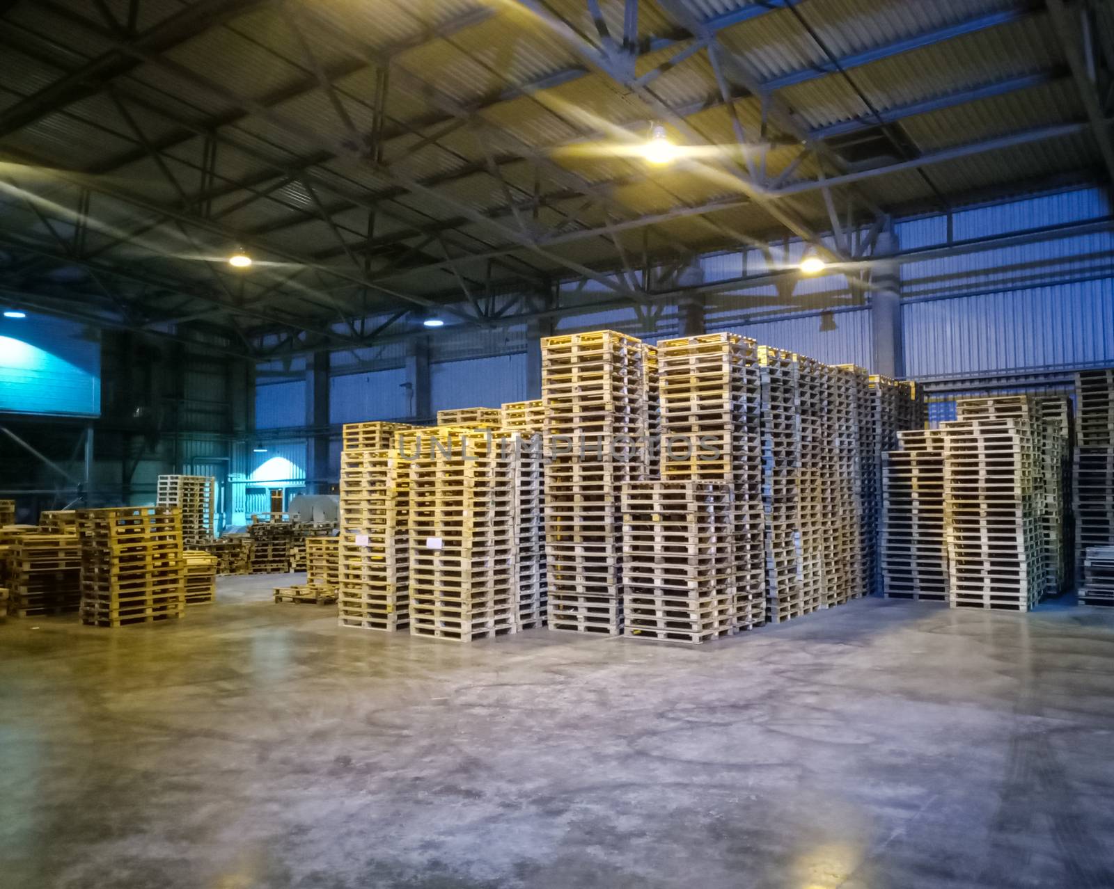 Pallet racks inside a cement plant. Loading shop of a cement plant.