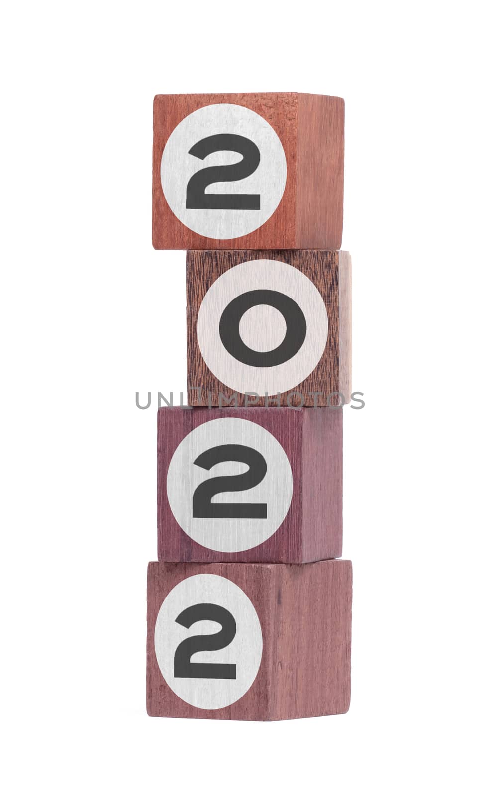 Four isolated hardwood toy blocks on white, saying 2022