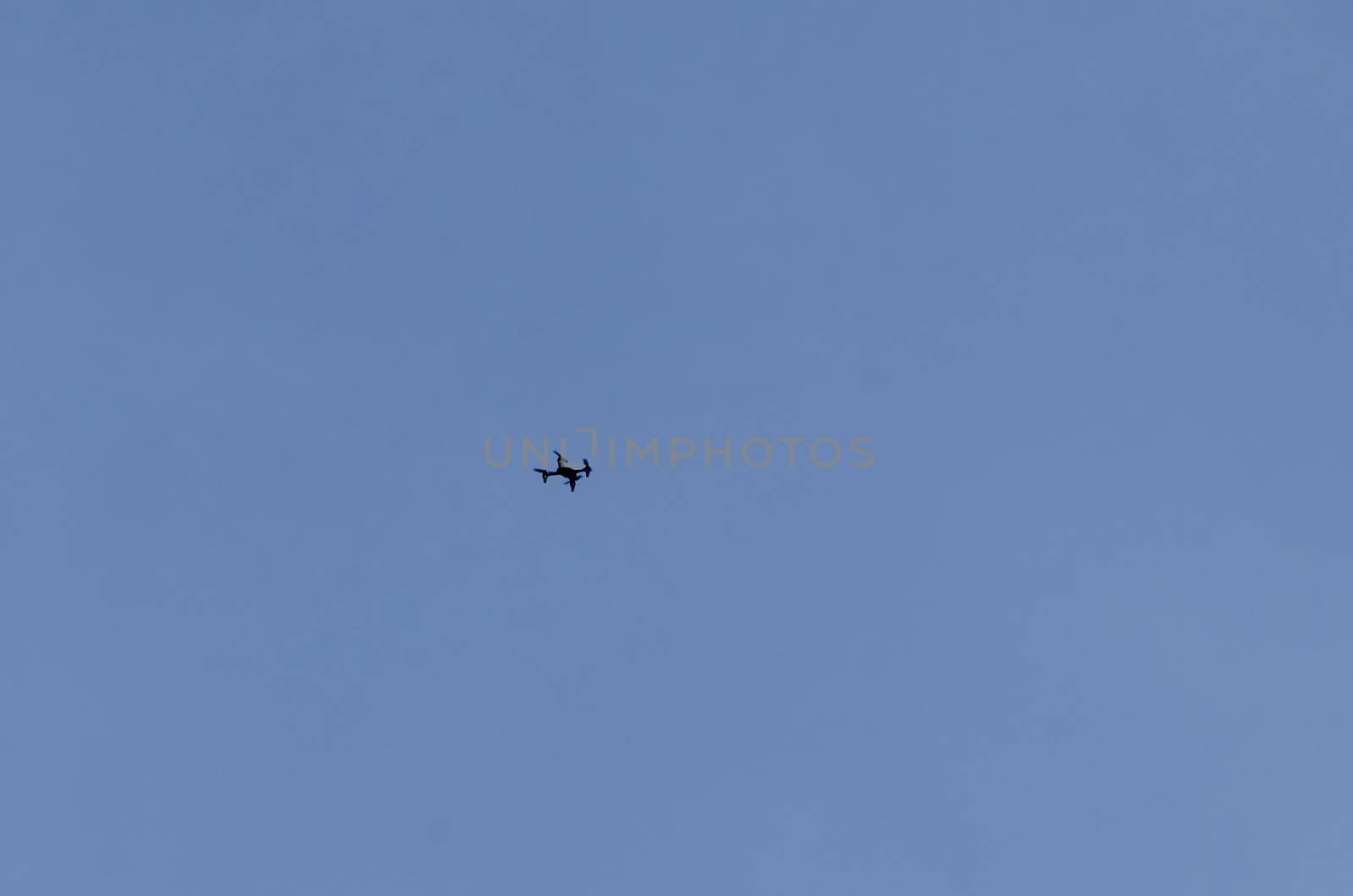 A remote control drone flies high in the sky above Plana mountain, Bulgaria