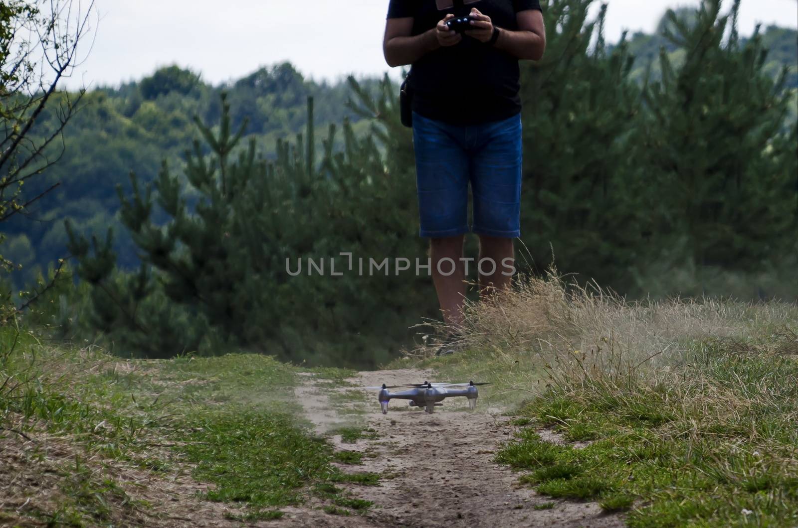 A remote control drone landing  at path in the Plana mountain, Bulgaria