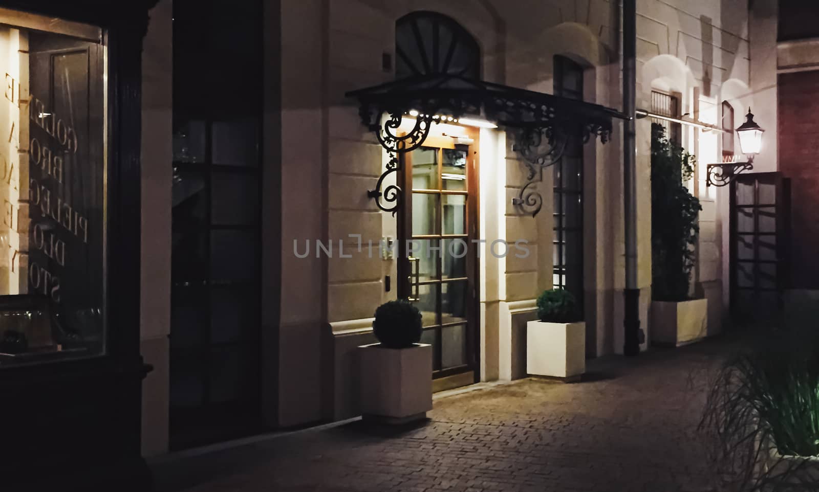 Exterior facade of classic building in the European city at night, architecture and design by Anneleven