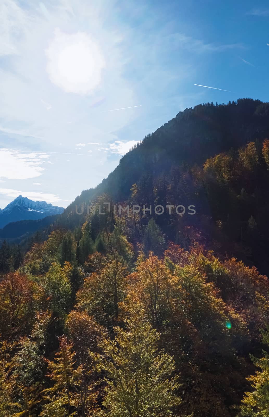 Beautiful nature of European Alps, landscape view of alpine mountains, lake and village on a sunny day, travel and destination scenery