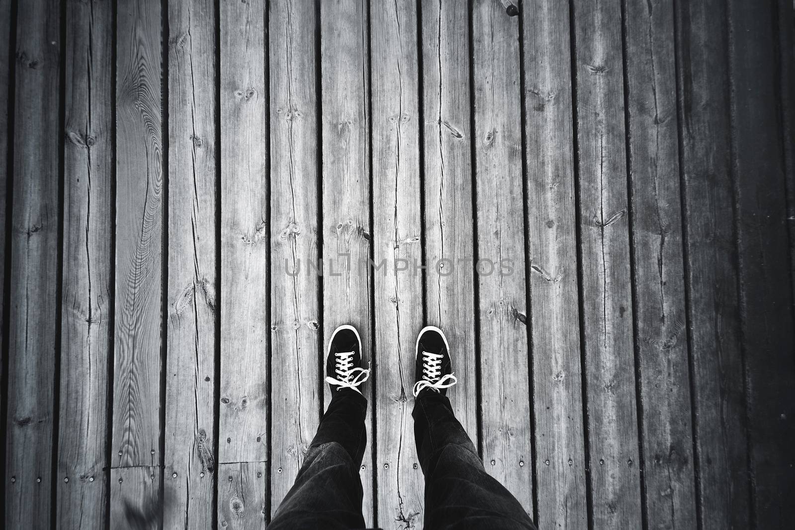 Man standing on the old wooden floor. by satariel