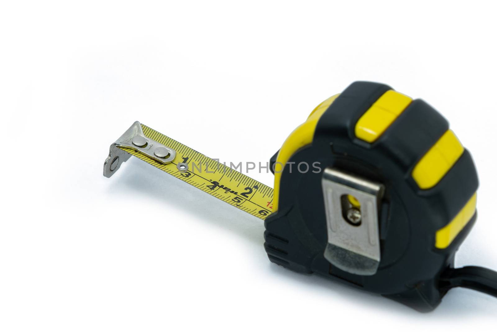 retractable yellow metal measuring tape isolated on a white background. Measurements expressed in centimeters and feet. Construction measuring instrument by peerapixs