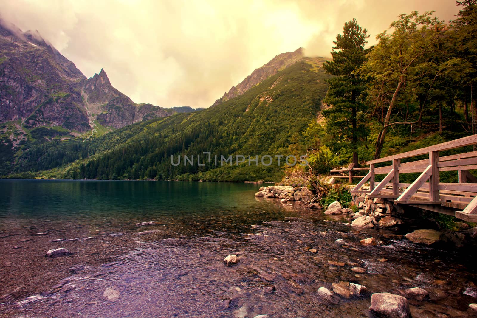Lake in mountains. Fantasy and colorfull nature landscape.
