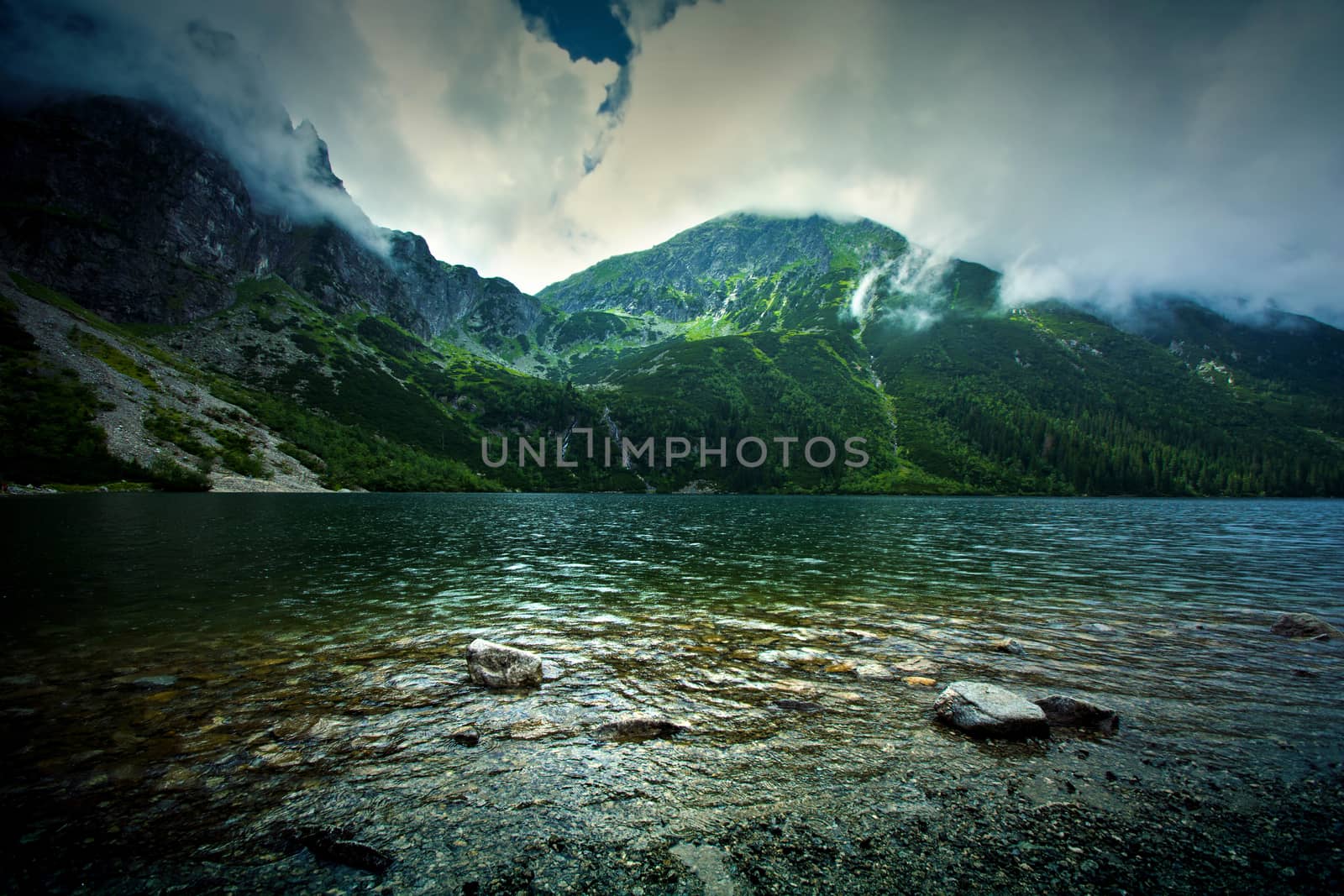 Lake in mountains. Fantasy and colorfull nature landscape. Morskie Oko lake.