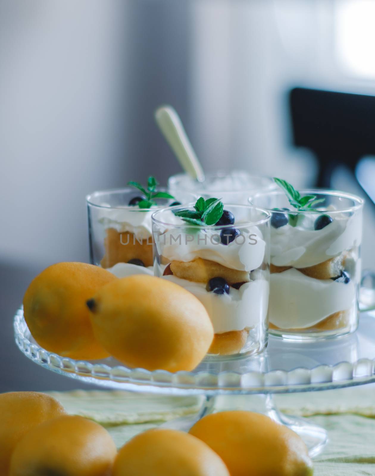 Homemade tiramisu with lemons served on table. by Emurado