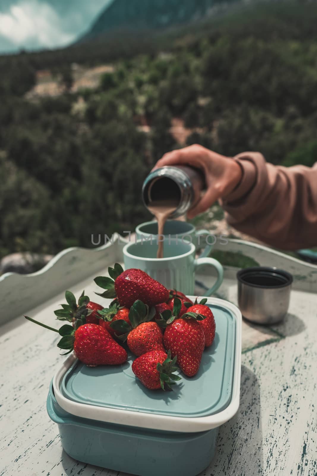 Close-up of picnic food: delicious fresh strawberries and coffee. by Emurado