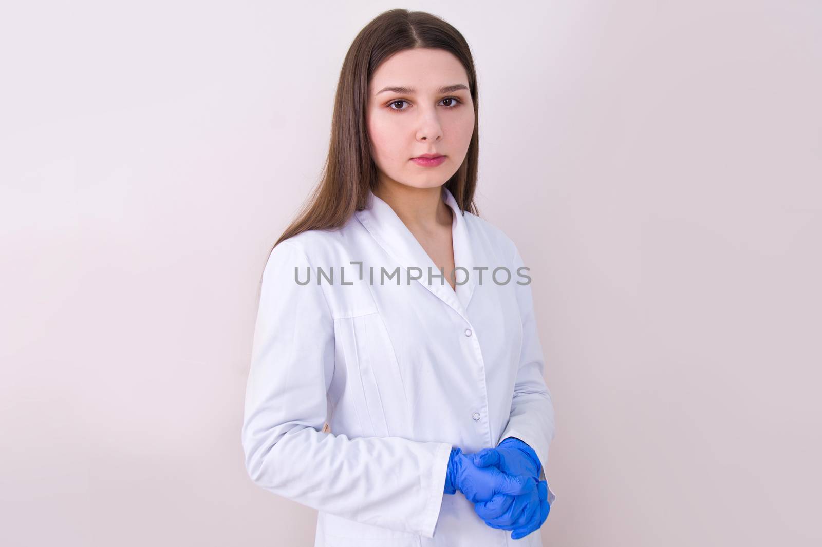 Female doctor wearing protection gloves. by satariel