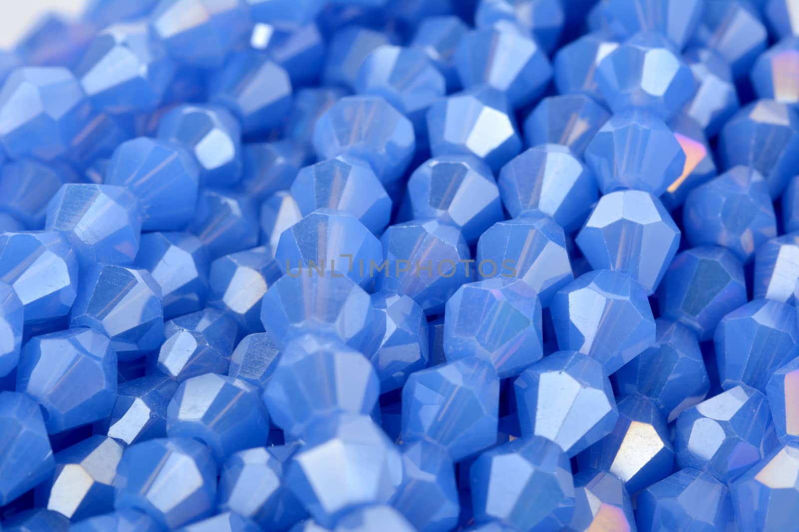 Beautiful Light Blue Glass Sparkle Crystal Isoalted Beads on white background. Use for diy beaded jewelry