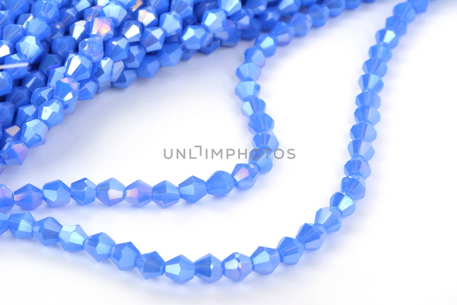 Beautiful Light Blue Glass Sparkle Crystal Isoalted Beads on white background. Use for diy beaded jewelry