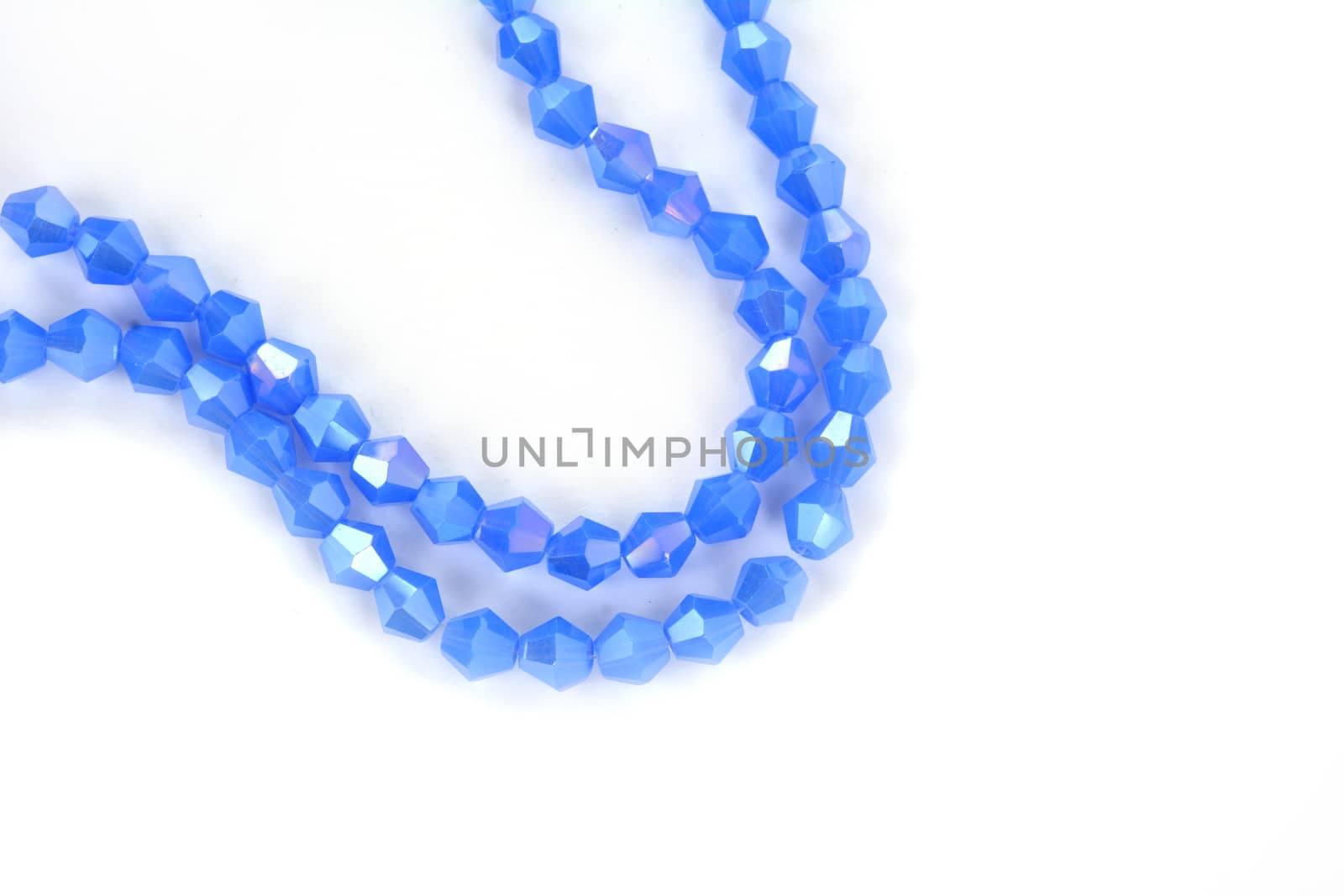 Beautiful Light Blue Glass Sparkle Crystal Isoalted Beads on white background. Use for diy beaded jewelry