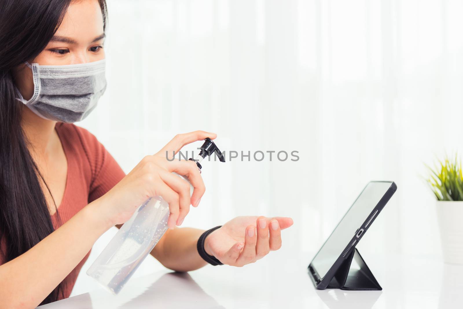 Business young woman working from home office he quarantines dis by Sorapop