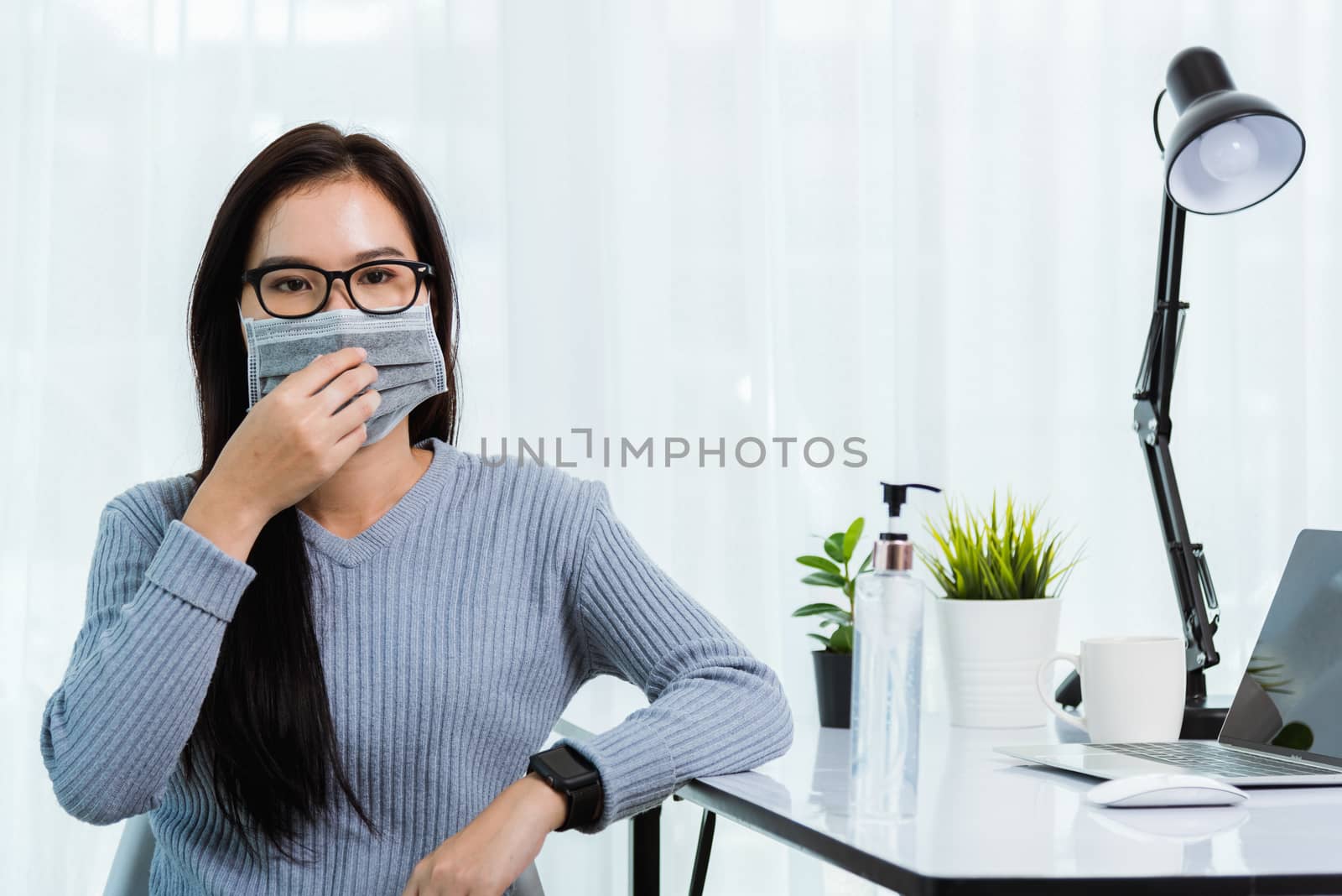 Business woman during wearing face mask protective working from  by Sorapop