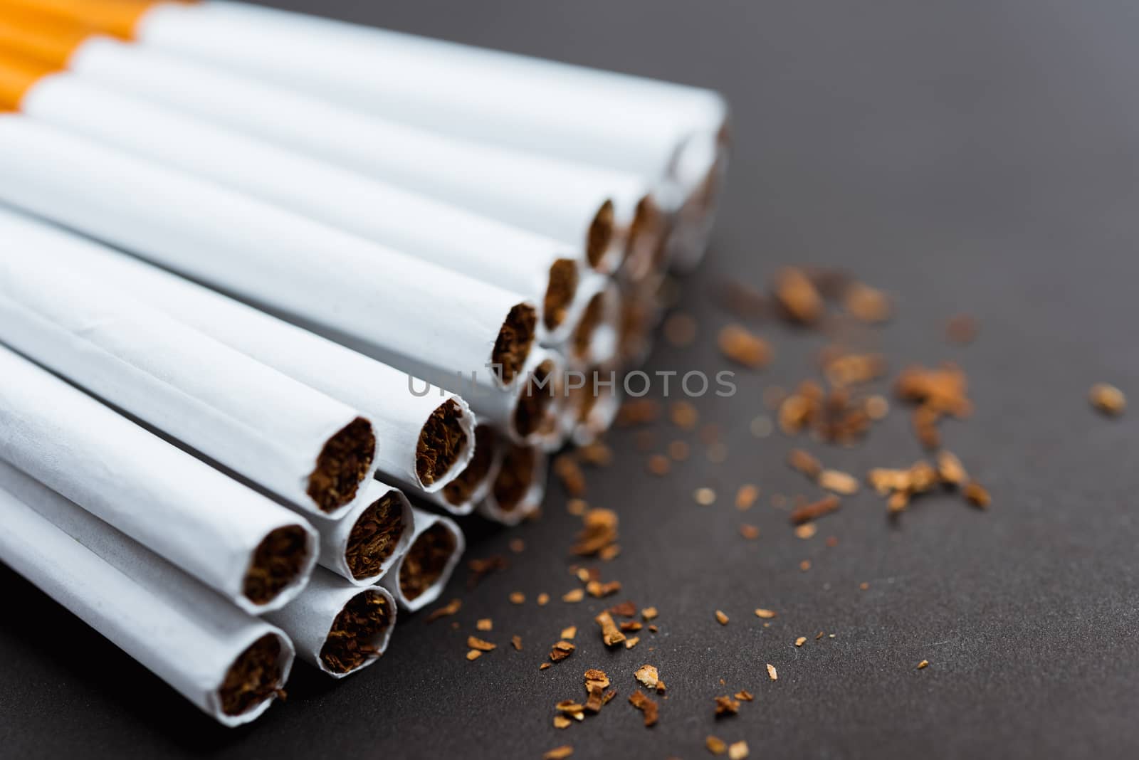 stack pile cigarette or tobacco on black background by Sorapop