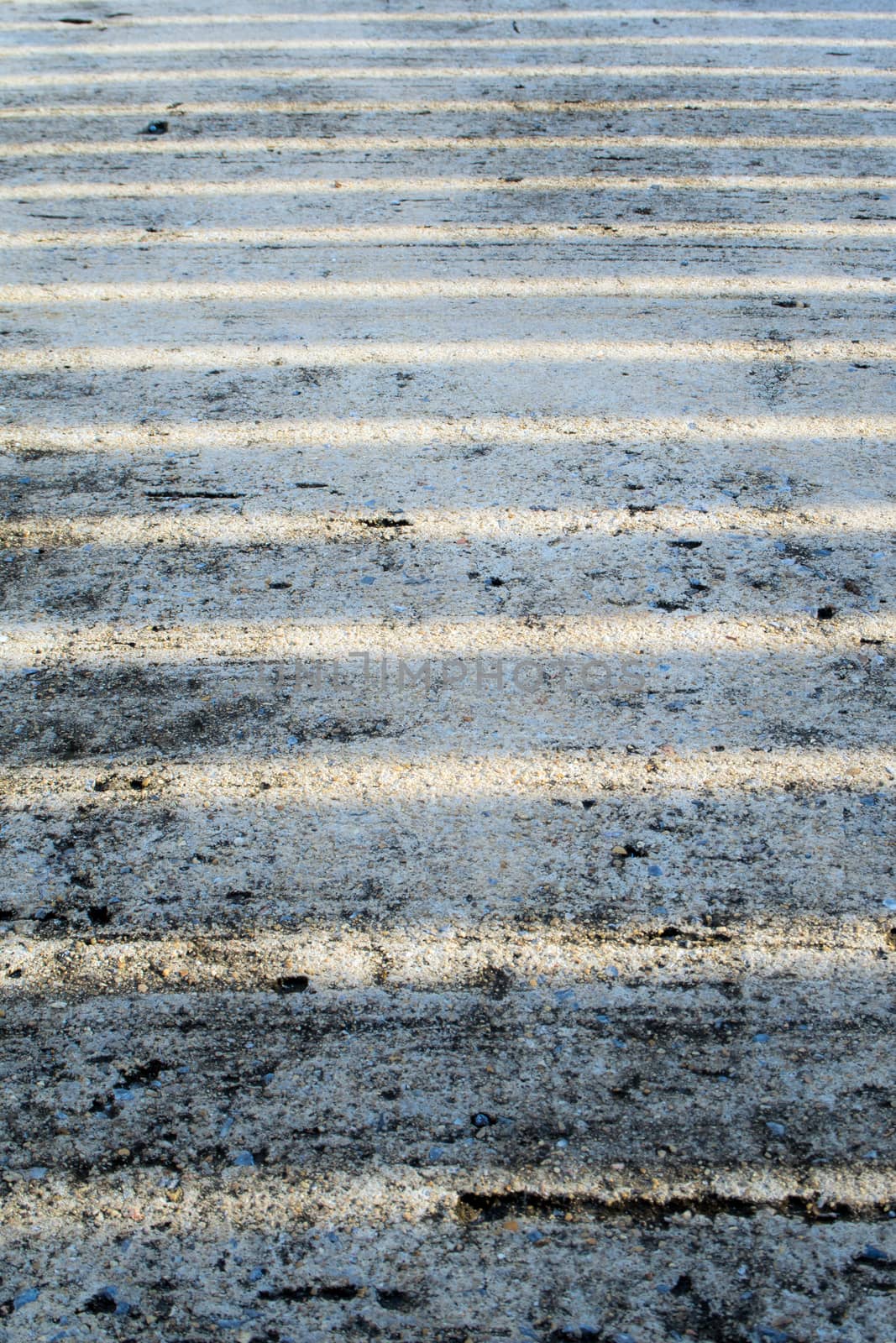 line of light on rough concrete floor