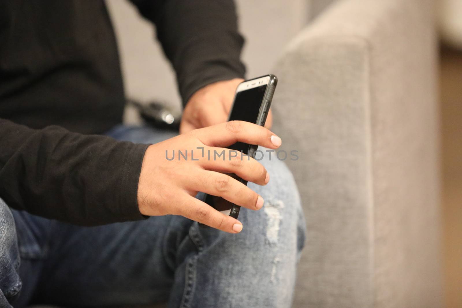 Male Model hands with cell phone by rajastills