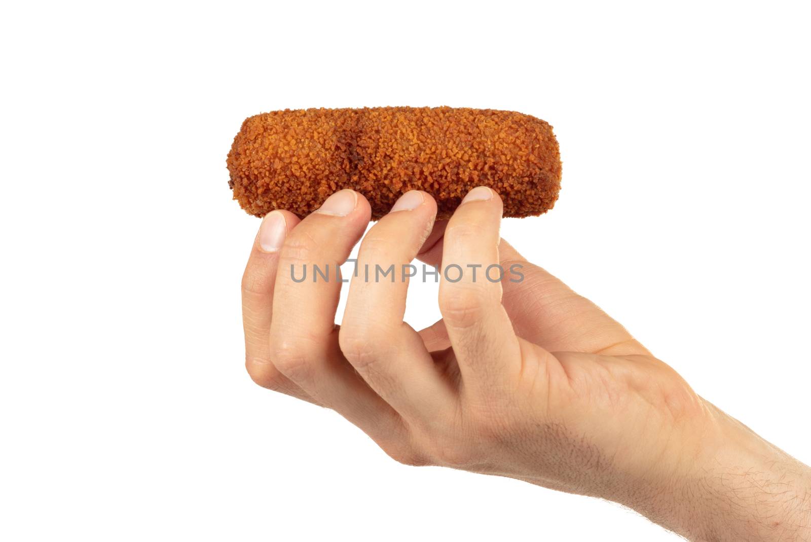 Brown crusty dutch kroket held by an adult man, isolated on a white background